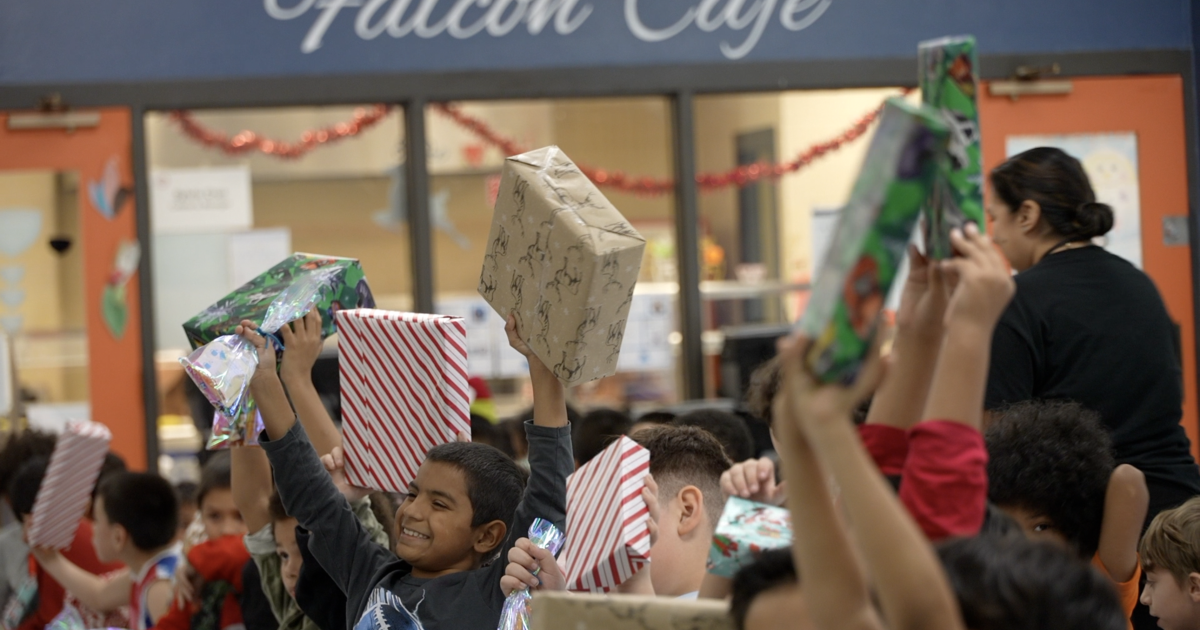 W.B. Travis students get Christmas gifts amid potential school closure