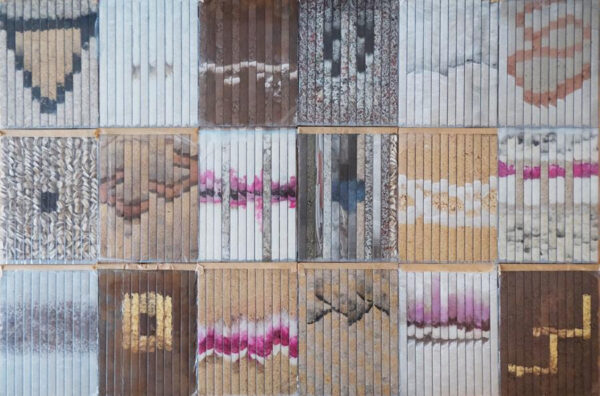 An artwork featuring geologic landscape inamges cut into strips in a rectangular grod.