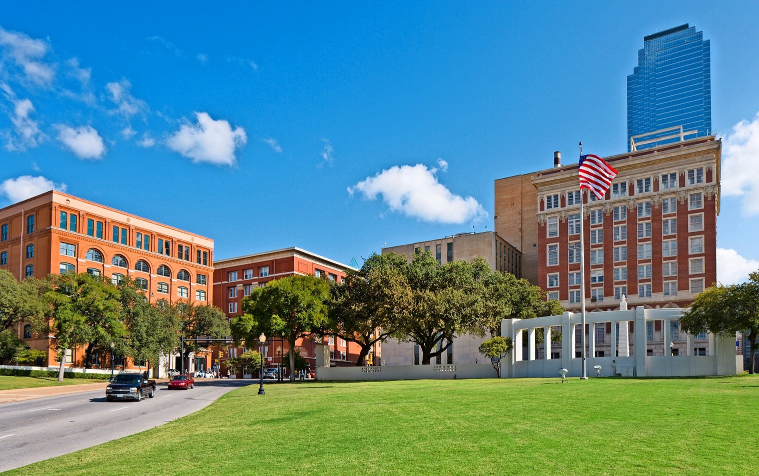 Site of the Kennedy assassination looking towards Dealey Plaza with the old Texas Schoolbook Depository to the left.