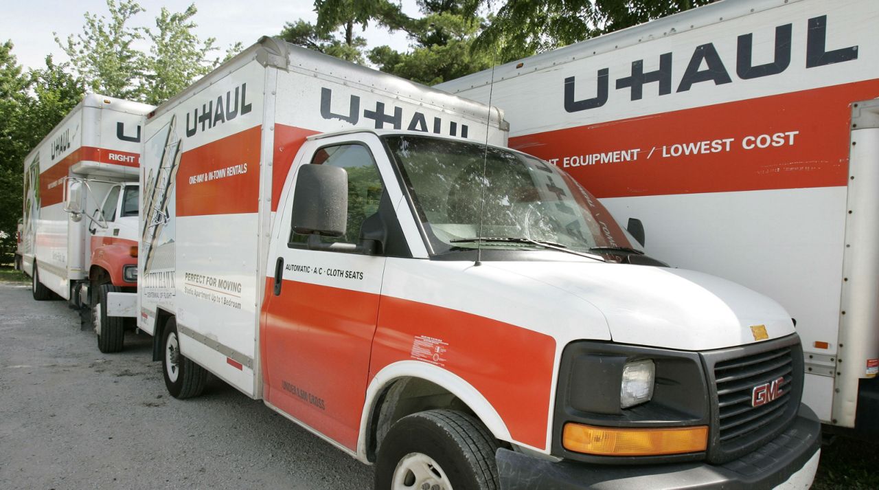 In this June 14, 2006 file photo are U-Haul trucks sitting on a dealer lot in Des Moines, Iowa. (AP Photo/Charlie Neibergall)
