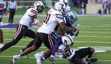 Nov 1, 2025; Manhattan, Kansas, USA; Kansas State Wildcats wide receiver Jayce Brown (1) is tackled by Texas Tech Red Raiders defensive back Amier Boyd (27) and linebacker David Bailey (31) during the third quarter at Bill Snyder Family Football Stadium. Mandatory Credit: Scott Sewell-Imagn Images