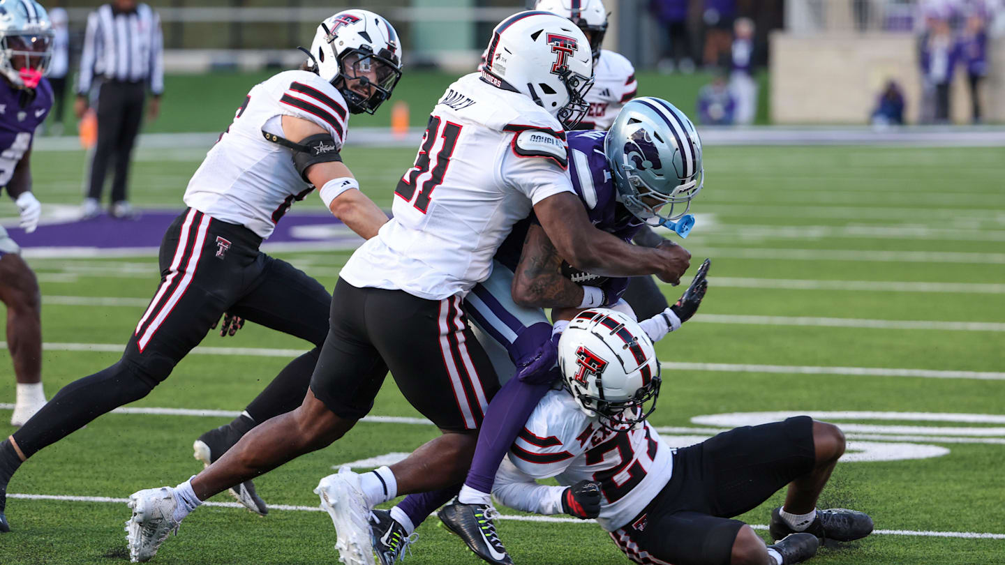 Nov 1, 2025; Manhattan, Kansas, USA; Kansas State Wildcats wide receiver Jayce Brown (1) is tackled by Texas Tech Red Raiders defensive back Amier Boyd (27) and linebacker David Bailey (31) during the third quarter at Bill Snyder Family Football Stadium. Mandatory Credit: Scott Sewell-Imagn Images