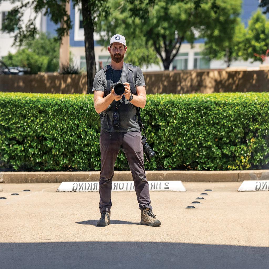 May 31 12:20 P.M. My reflection in an office building on the northbound side of Central Expressway, south of Meadow Road.
