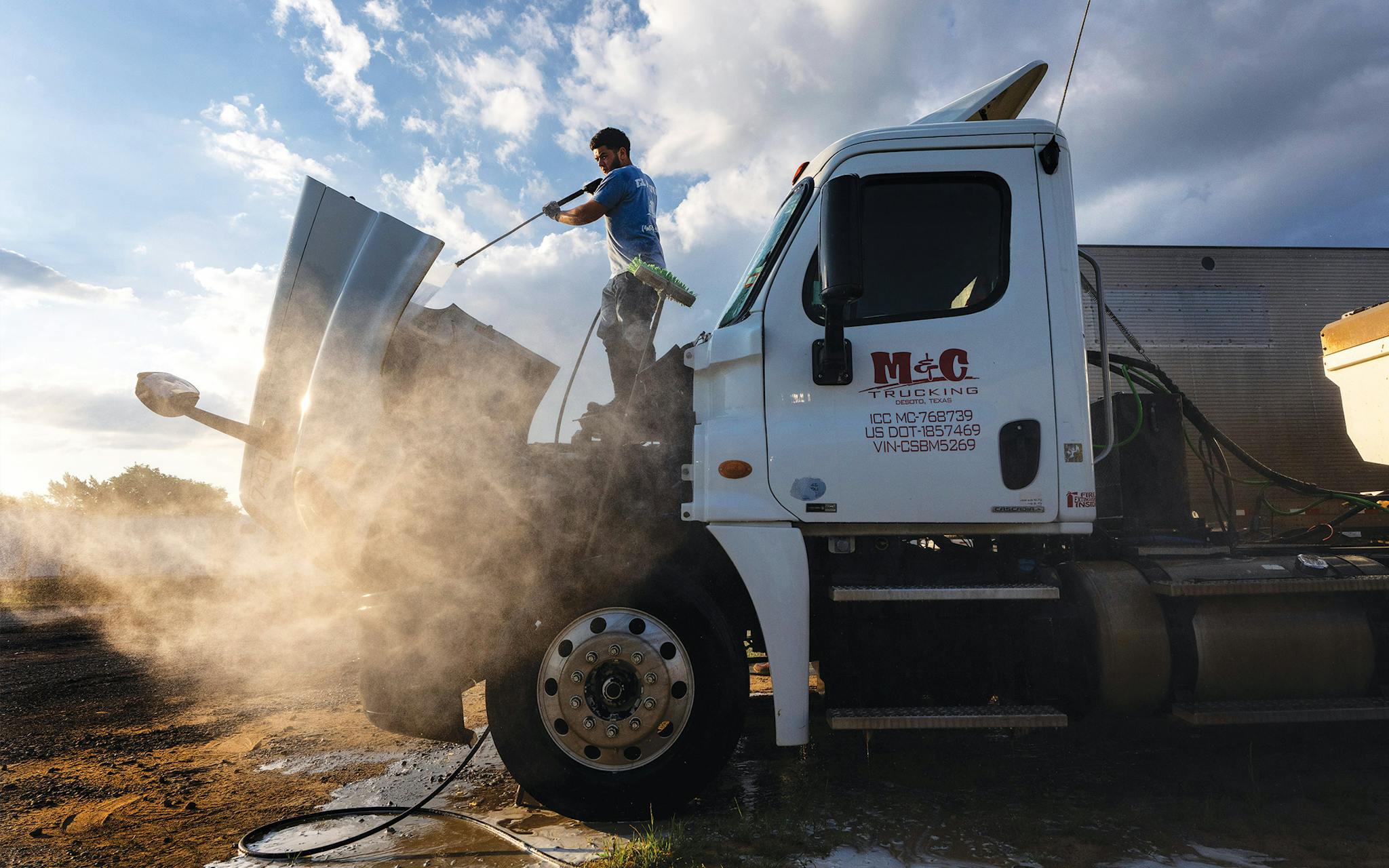 May 10 7:38 A.M. Jonathan Paredes washing a tractor at NFL Logistics, on Telephone Road, in far South Dallas.