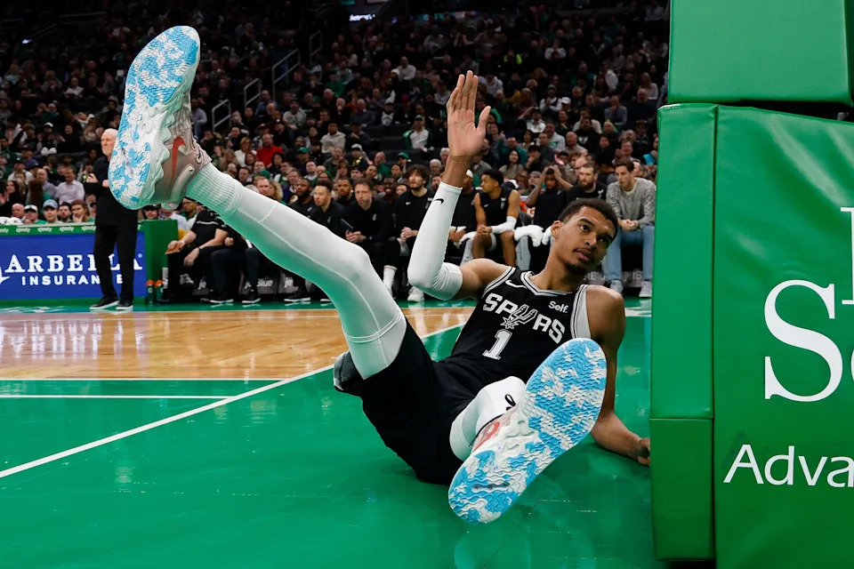 Jan 17, 2024; Boston, Massachusetts, USA; San Antonio Spurs center Victor Wembanyama (1) tumbles after being unable to keep a ball in play during the first quarter against the Boston Celtics at TD Garden. Mandatory Credit: Winslow Townson-USA TODAY Sports