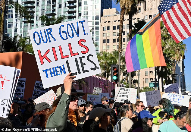 Activists protest the Wednesday shooting death of Renee Good in Minneapolis at Pershing Square in Los Angeles on Saturday