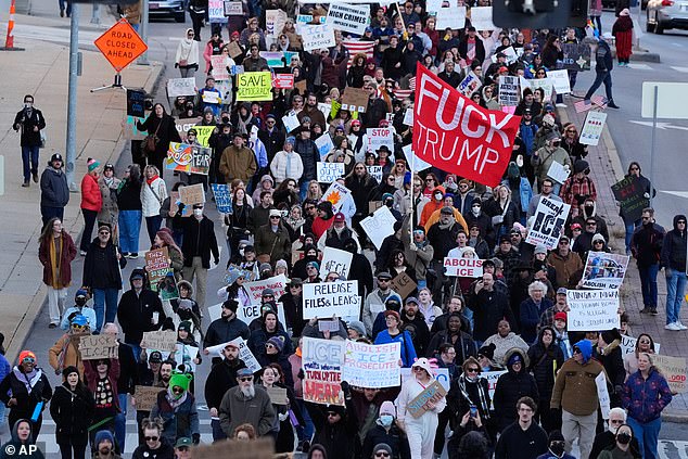 Chants condemning ICE echoed through the streets as protesters marched between federal buildings