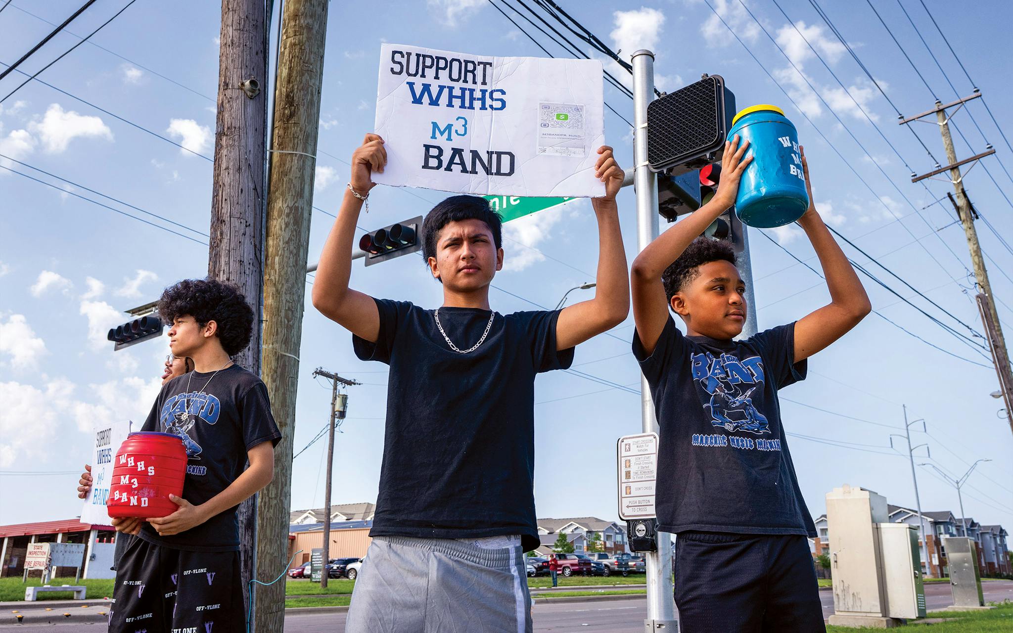 May 10 9:38 A.M. Sophomores Jose Escobar and Joan Gonzalez and sixth grader Dylan Vincent raising money for the Wilmer Hutchins High School Marching Music Machine.