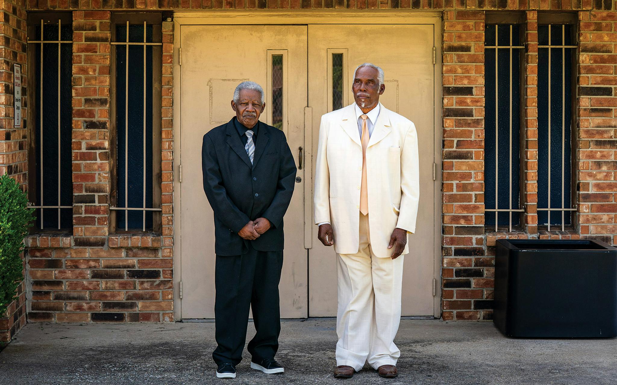 May 10 10:58 A.M. Roscoe Harris, Jr., 78 (left) and Charles Taylor, 80, stand outside Dallas Fellowship Seventh Day Adventist Church, where they are both members, before attending a service.