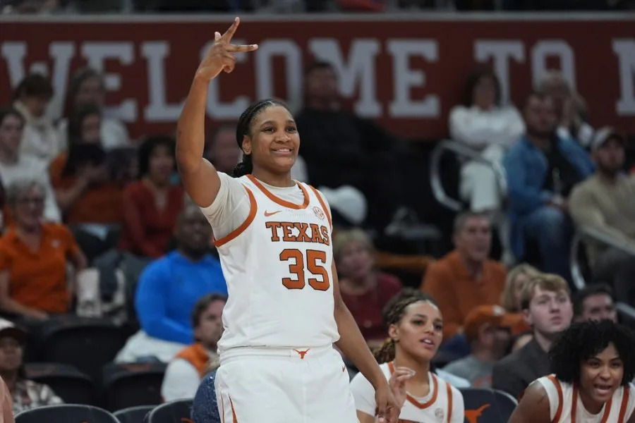 Texas forward Madison Booker (35) cheers for a score against Texas A&M during the second half of an NCAA college basketball game in Austin, Texas, Sunday, Jan. 18, 2026. (AP Photo/Eric Gay)