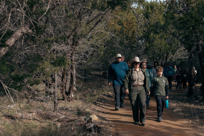 Park Ranger Kate Fisher leads a guided hike on Raptor Ridge Trail at Pinto Mountains State Park on Jan. 1, 2026.