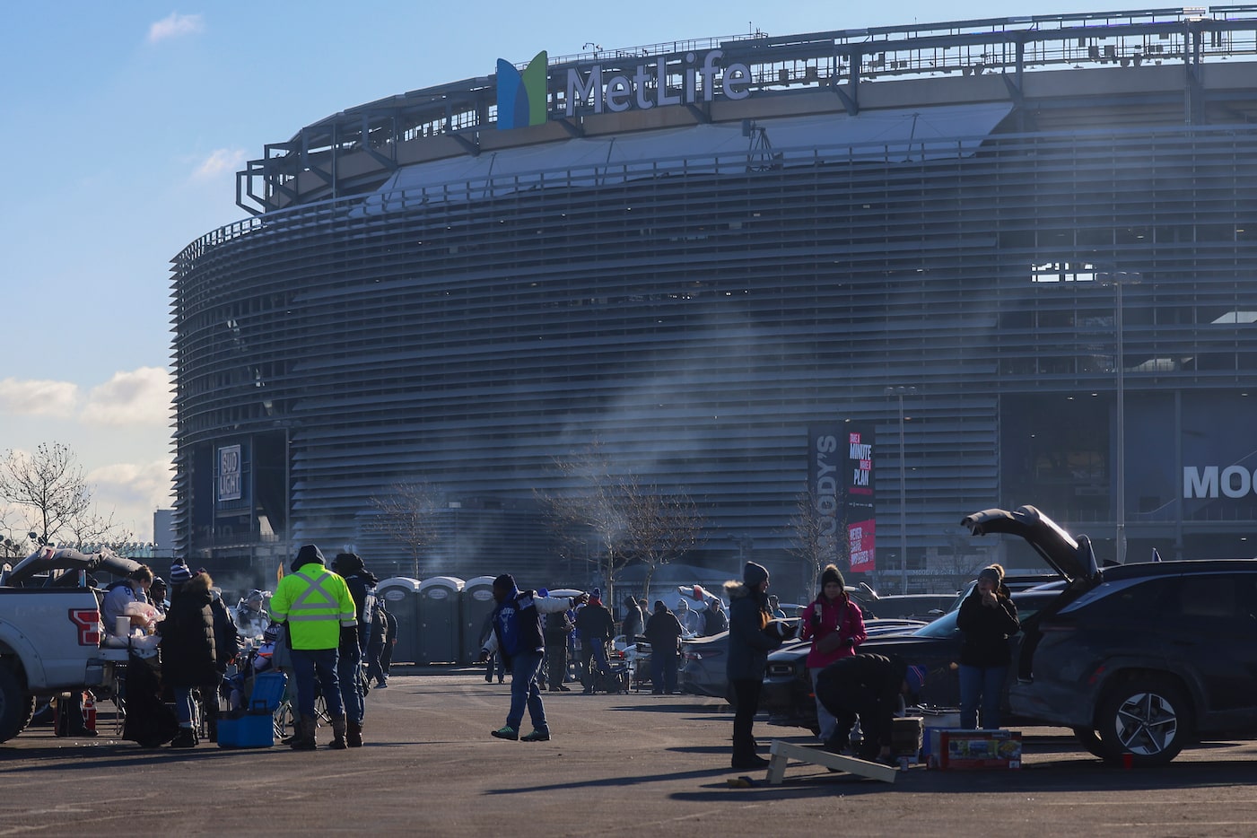 People tailgate before an NFL game between the Dallas Cowboys and the New York Giants on...