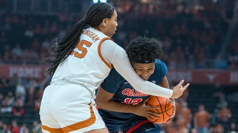 Texas forward Breya Cunningham, left, defends against Mississippi forward Christeen...