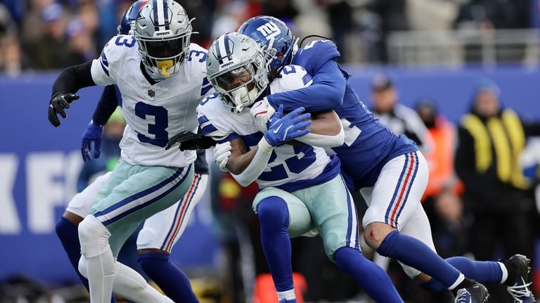 Dallas Cowboys running back Jaydon Blue (23) is tackled by...