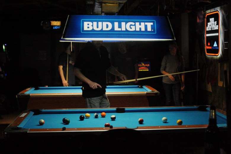 Players shoot pool on newly resurfaced tables on Dec. 27, 2025, at The Country Club in Lufkin.