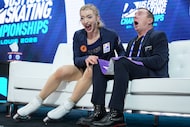 Amber Glenn reacts to seeing her scores after competing during the women's free skating...