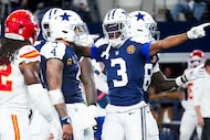 Dallas Cowboys wide receiver George Pickens (3) celebrates with quarterback Dak Prescott (4)...
