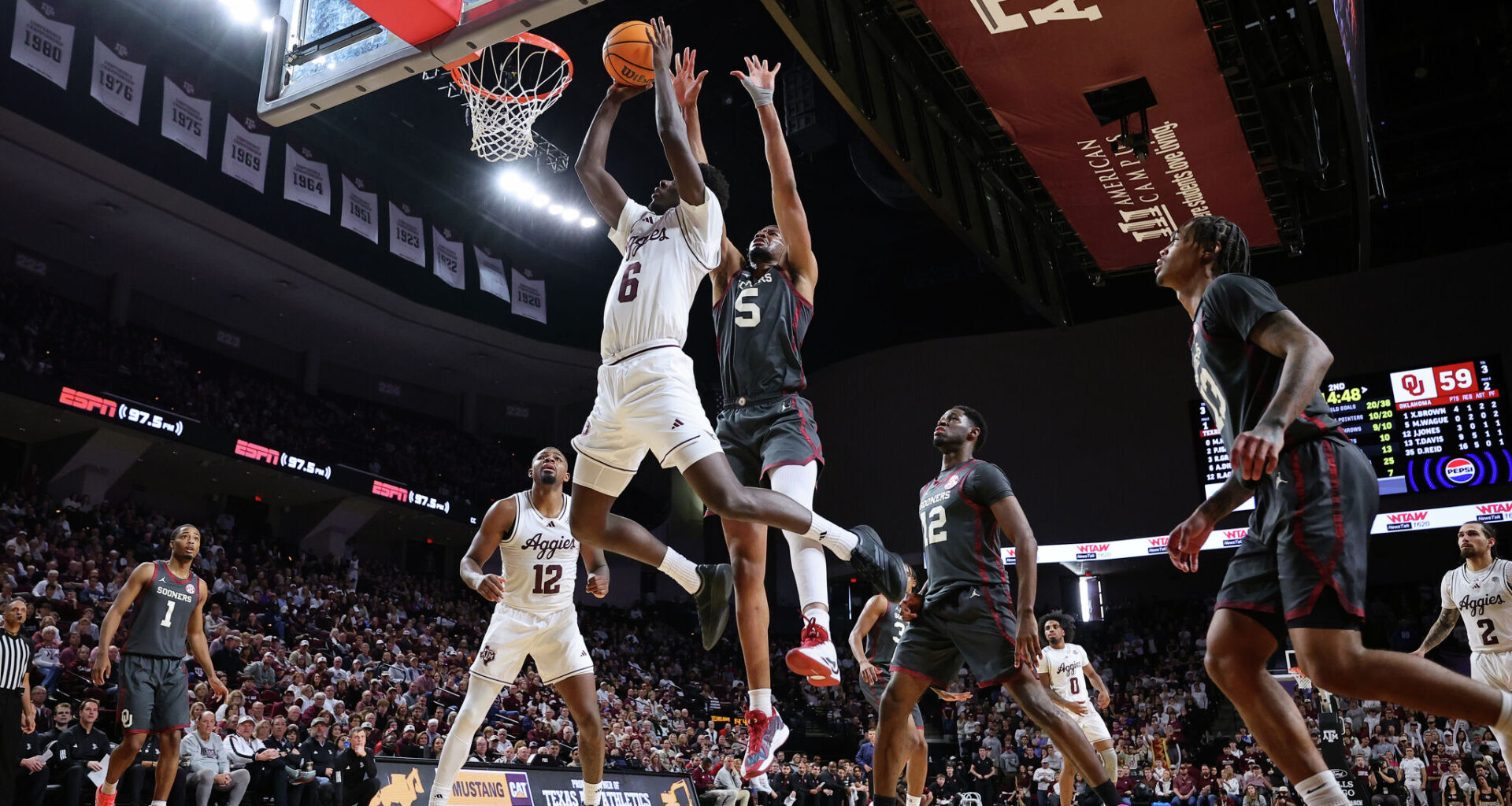 Tramon Mark, right, of the Texas Longhorns drives to the basket during the first half around Keitenn Bristow of the Alabama Crimson Tide at Coleman Coliseum on Jan. 10, 2026, in Tuscaloosa, Ala. (Photo by Brandon Sumrall/Getty Images)