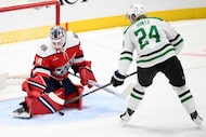 Washington Capitals goaltender Logan Thompson (48) stops the puck against Dallas Stars...