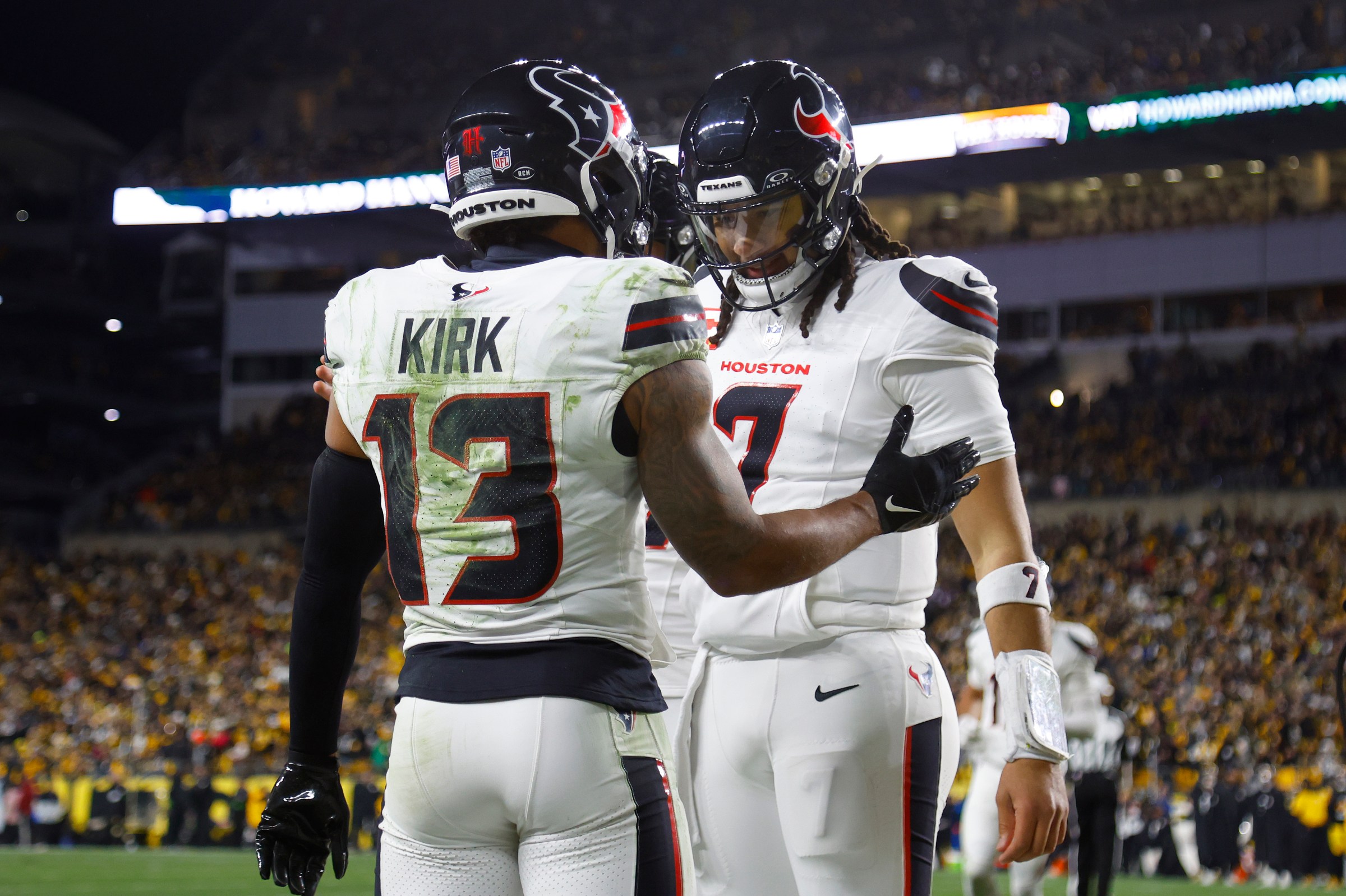 PITTSBURGH, PENNSYLVANIA - JANUARY 12: Christian Kirk #13 of the Houston Texans and C.J. Stroud #7 of the Houston Texans celebrate after a touchdown in the second quarter of an NFL wild card playoff game against the Pittsburgh Steelers at Acrisure Stadium on January 12, 2026 in Pittsburgh, Pennsylvania. (Photo by Justin K. Aller/Getty Images)