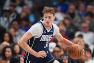 Dallas Mavericks forward Cooper Flagg (32) dribbles up court during an NBA basketball game...