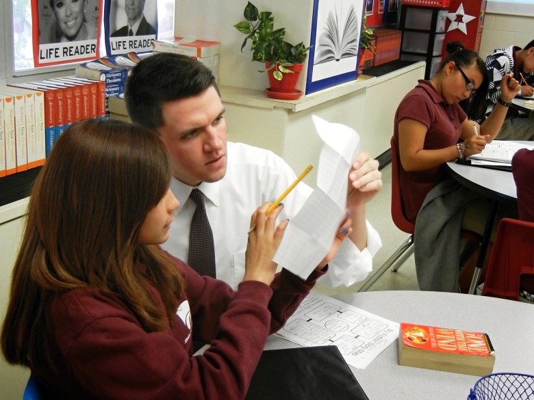 State Rep. and U.S. Senate candidate James Talarico works with a student at Jeremiah Rhodes Middle School in San Antonio, where he taught between 2011-13. 