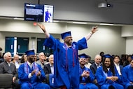 Dallas College construction and HVAC student Orlan Stewart throws his arms up in celebration...