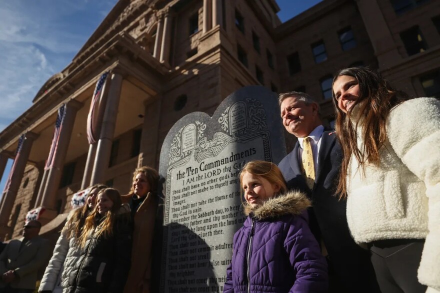 Tarrant County Judge Tim O’Hare stands in front of a monument displaying a version of the Ten Commandments during a dedication ceremony outside the Tarrant County Courthouse on Jan. 16, 2026.