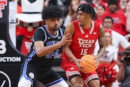Texas Tech forward JT Toppin (15) drives to the hoop against BYU forward Abdullah Ahmed (34)...