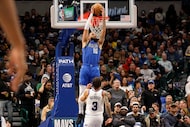 Dallas Mavericks forward Caleb Martin (16) shoots the ball as Utah Jazz guard Keyonte George...