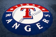 The team logo fills the center of the room in the clubhouse of the Texas Rangers newly...