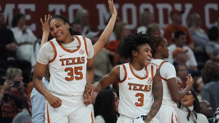 Texas forward Madison Booker (35) and guard Rori Harmon (3)...