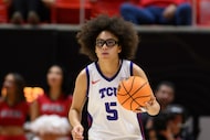 TCU guard Olivia Miles brings the ball up court during the second half of an NCAA college...