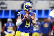 Los Angeles Rams quarterback Matthew Stafford (9) looks to throw during the first half of an...