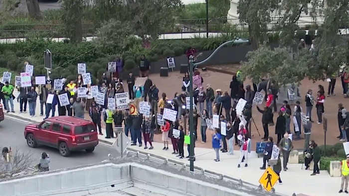 Dozens protest in San Antonio against immigration enforcement on Trump’s one-year mark in office