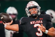 Melissa quarterback Brett Holloway (3) warms up before the Class 5A Division II Region I...