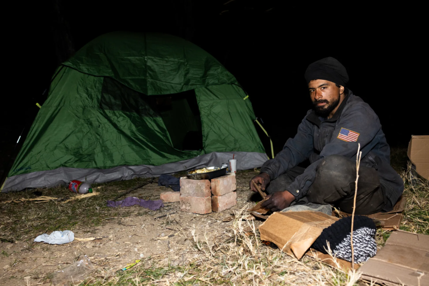 Israel Guajardo, 30, cooks his dinner over a campfire in Fort Worth on Jan. 22, 2026. Guajardo is one of several people experiencing homelessness who was surveyed for Tarrant County’s annual Point in Time Count.