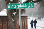 Snow falls on Winterplace Circle on Thursday, Jan. 9, 2025, in Plano. A winter storm is...