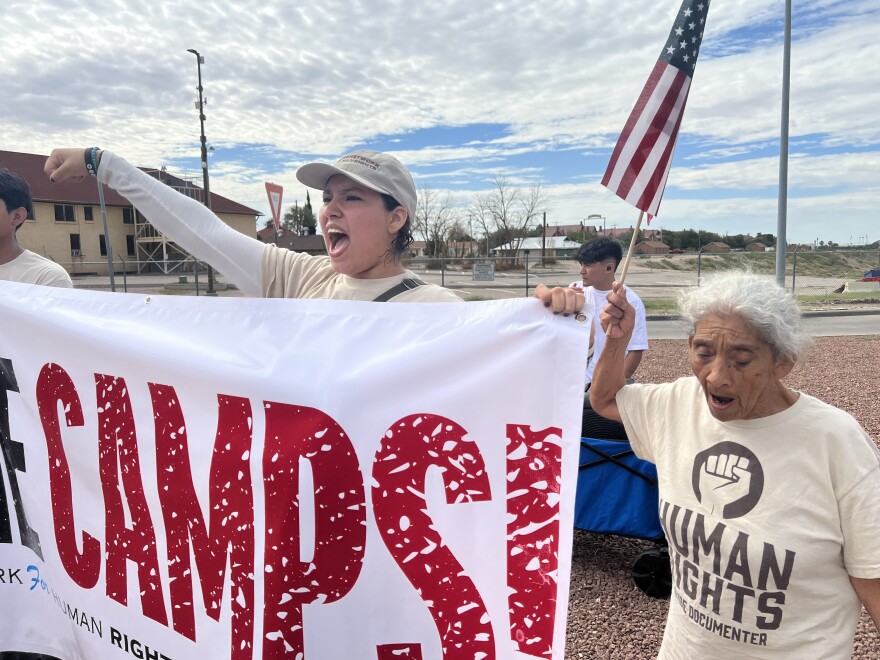 A woman chants outside the entrance to Fort Bliss where people gathered in August after learning the army post would be the site of the largest detention center in the country. Camp East Montana is on military property but operated by a private contractor. 