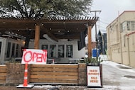 Gustos Burger Bar on Fort Worth’s Magnolia Avenue was open on Saturday, serving beer and...