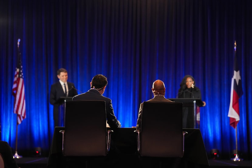 KXAN-TV's Daniel Marin and Dallas Morning News' Gromer Jeffers moderate a debate between...