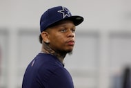 Rapper Yella Beezy watches the the Dallas Cowboys run drills at the team's NFL football...