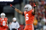 Ohio State defensive back Sonny Styles celebrates after breaking up a pass during the first...