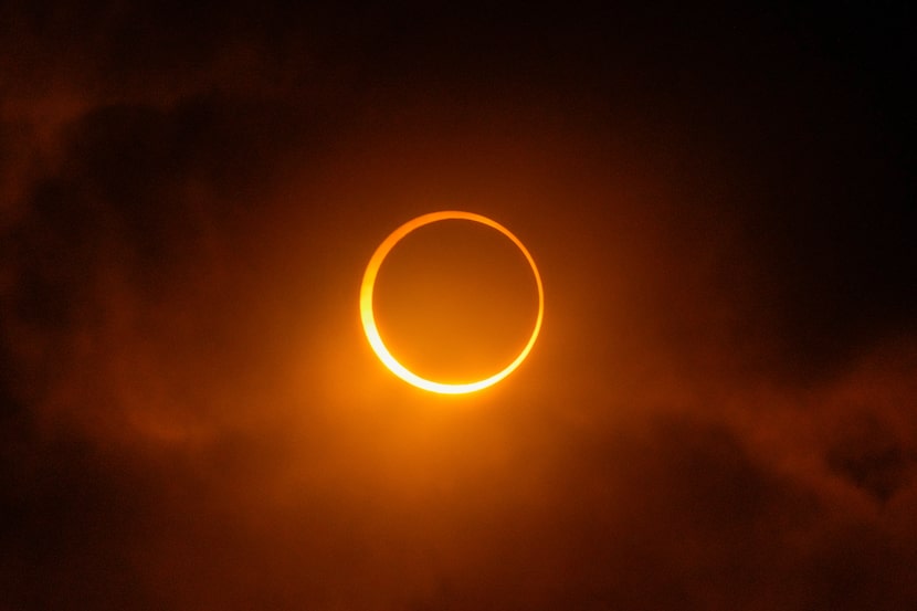The moon moves past the sun during an annular solar eclipse in Puerto San Julian, Argentina,...