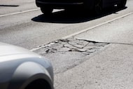A pothole on Ross Ave photographed on Wednesday, Feb. 21, 2024, in Dallas. 