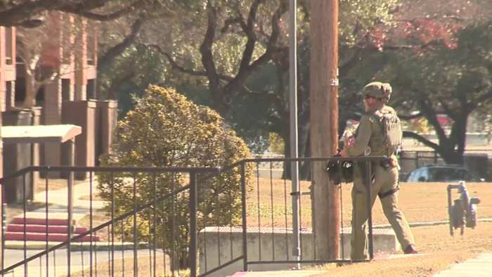 2 detained after police deploy tear gas, flash bangs on barricaded armed robbery suspects