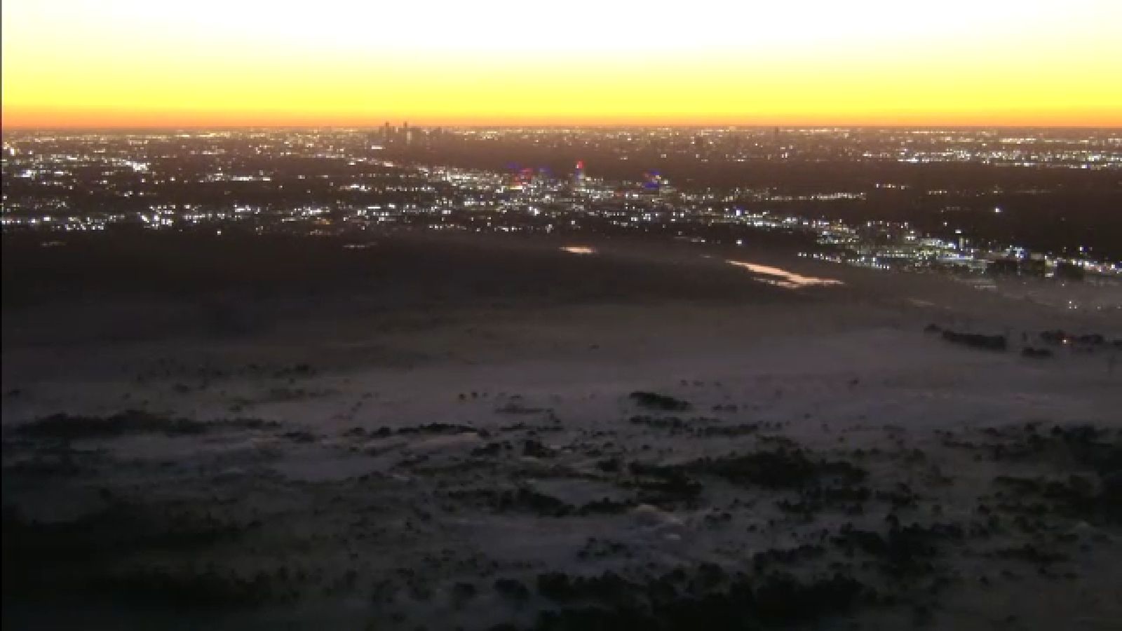Houston Fire Department and Texas A&M Forestry Service maintaining grass fire near I-10 and Eldridge Parkway