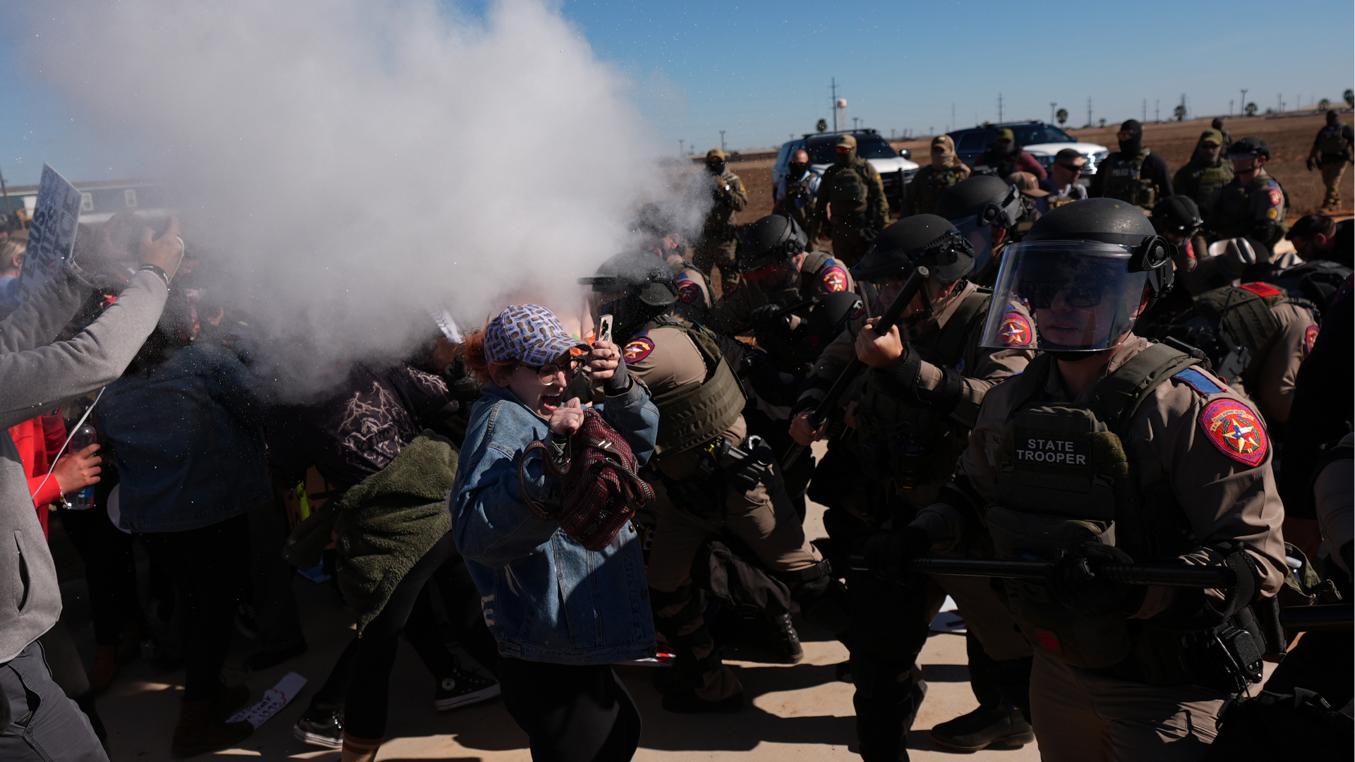 Pepper spray is used by Texas troopers to disperse protesters outside the South Texas Family Residential Center detention facility where Liam Ramos and his father are being detained in Dilley, Texas, Wednesday, Jan. 28, 2026. 