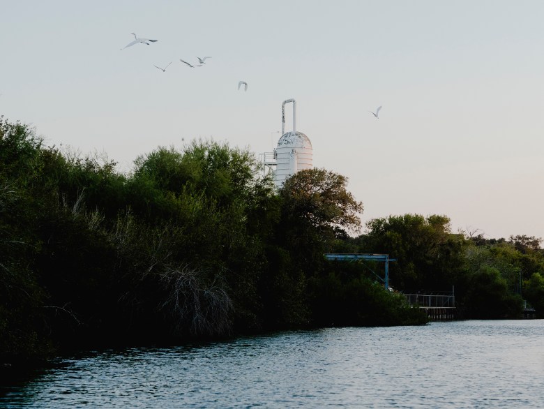 A tank from Celanese Plastics towers over the horizon on the Nueces River.