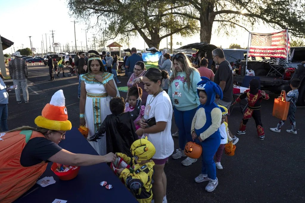 People take part in the “Trunk or Treat” community event at the Hidalgo County Republican Party Headquarters in McAllen on Oct. 30, 2025.